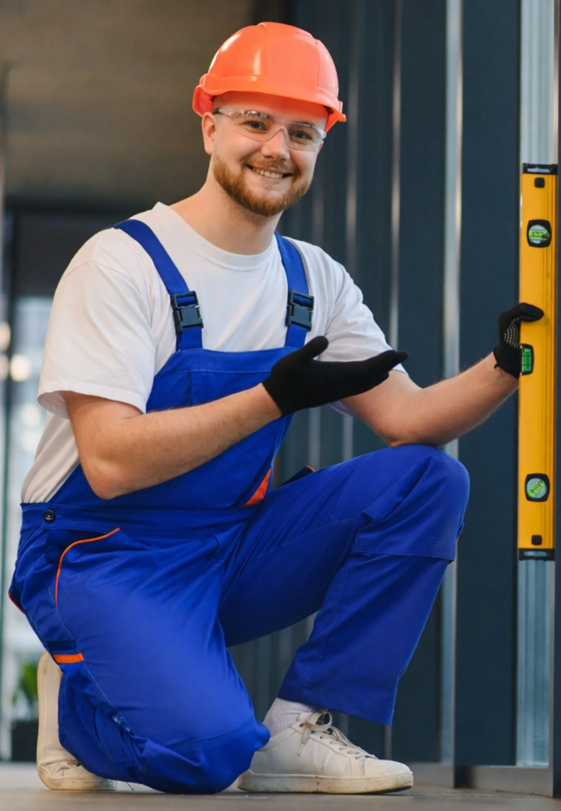 Friendly expert technician from Insta glass dallas showing a perfectly leveled glass installation in a Dallas commercial building.