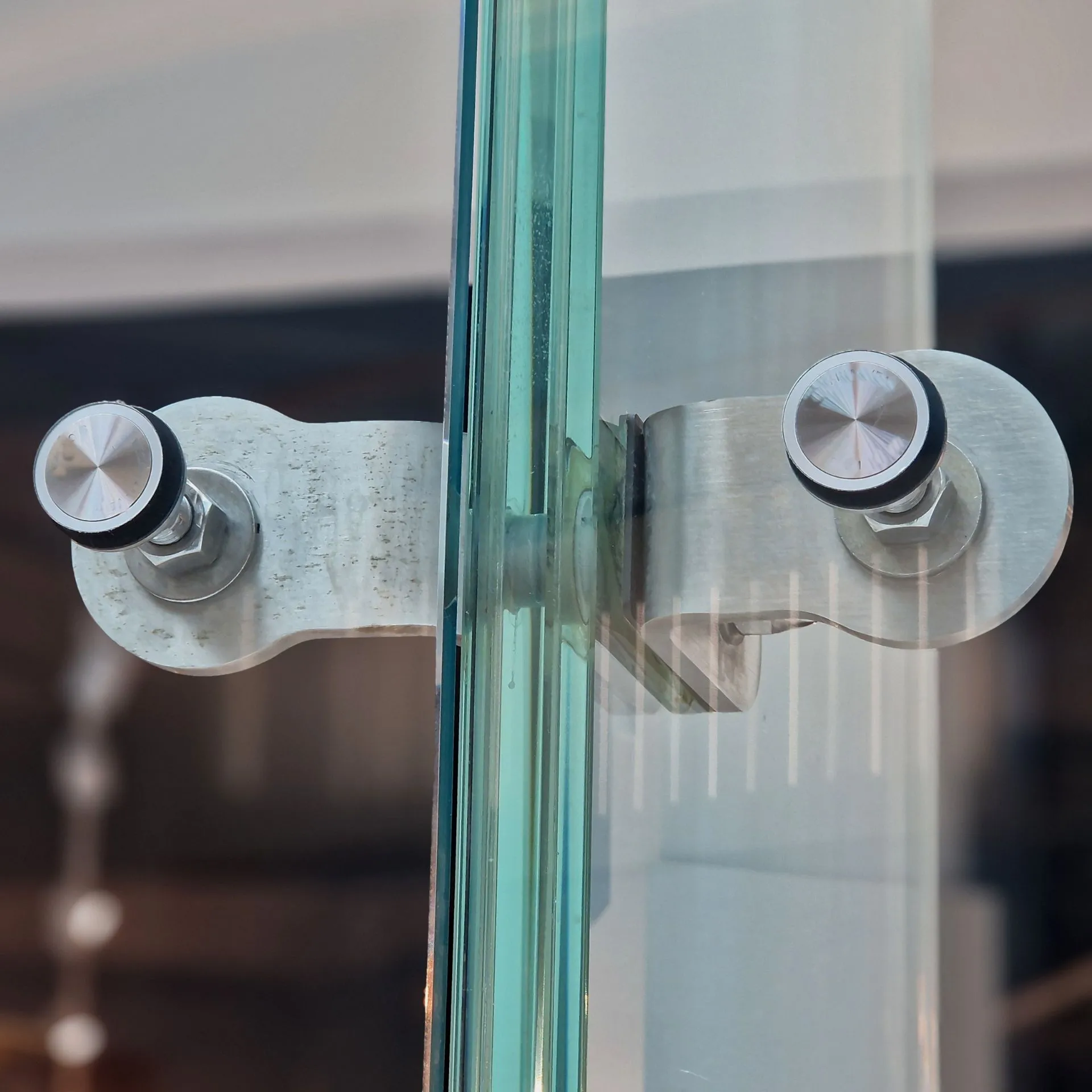 Custom frameless glass shower enclosure with matte black hardware installed in a modern Dallas bathroom.